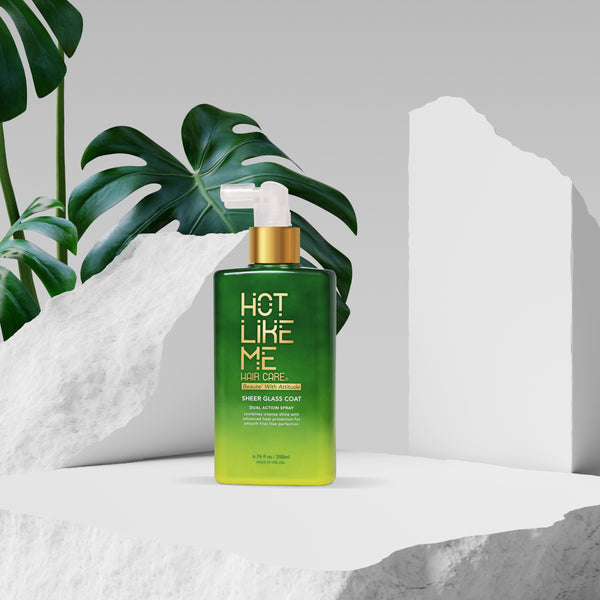 Sheer Glass Coat by Hot Like Me with green gradient design on a white surface with plant leaves in the background