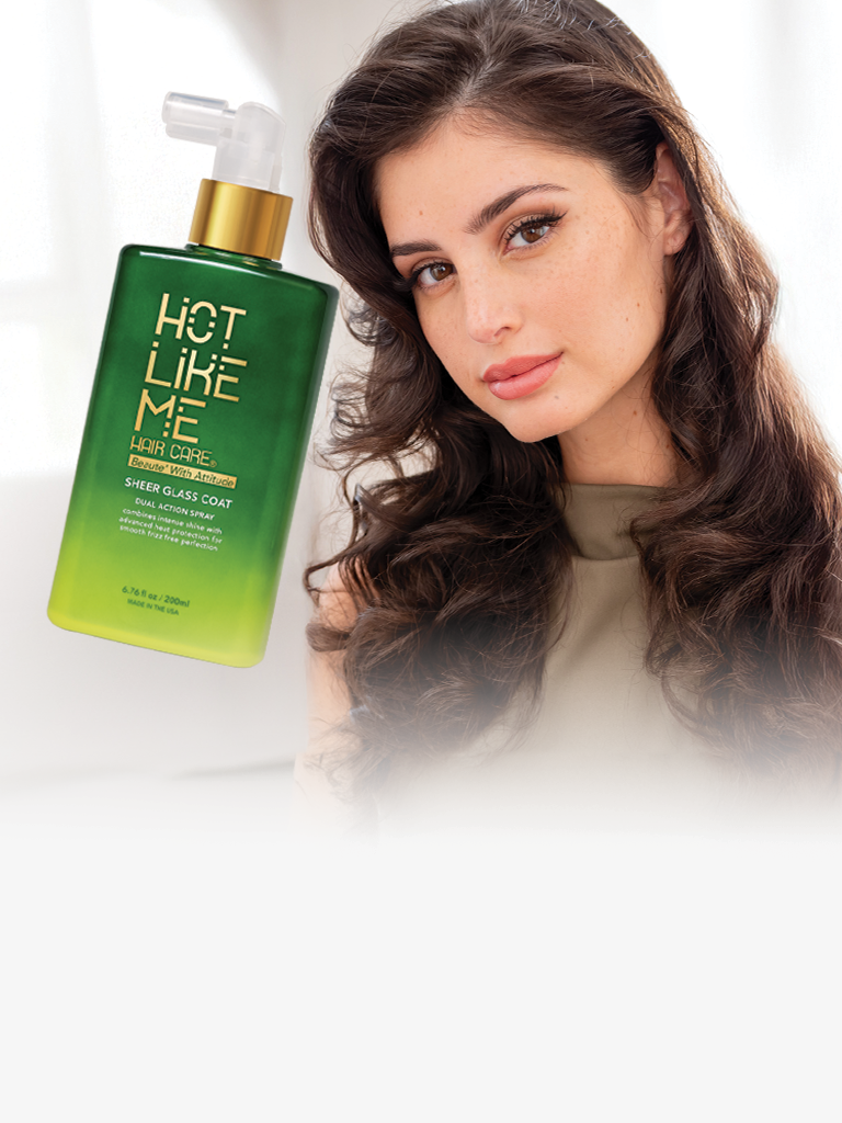 Woman with styled hair next to a bottle of 'Hot Like Me' Sheer Glass hair  product on a white background
